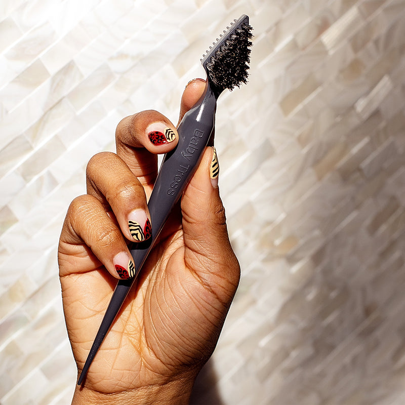 A 3-in-1 beauty tool for baby hairs, edges, and flyaways that has a comb to separate and smooth, a natural boar bristle brush for shaping, and a pointed tip for parting and finishing your style.
