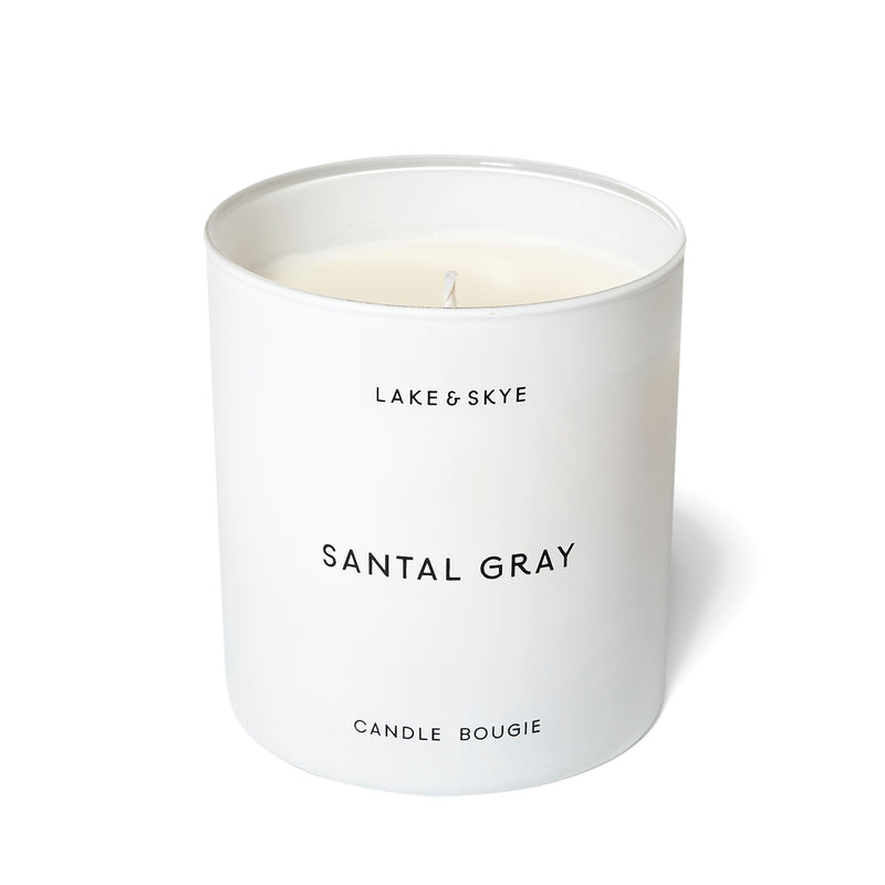 A soy candle with cozy and warm scent notes of sandalwood, violet leaf, musk, and cardamom.