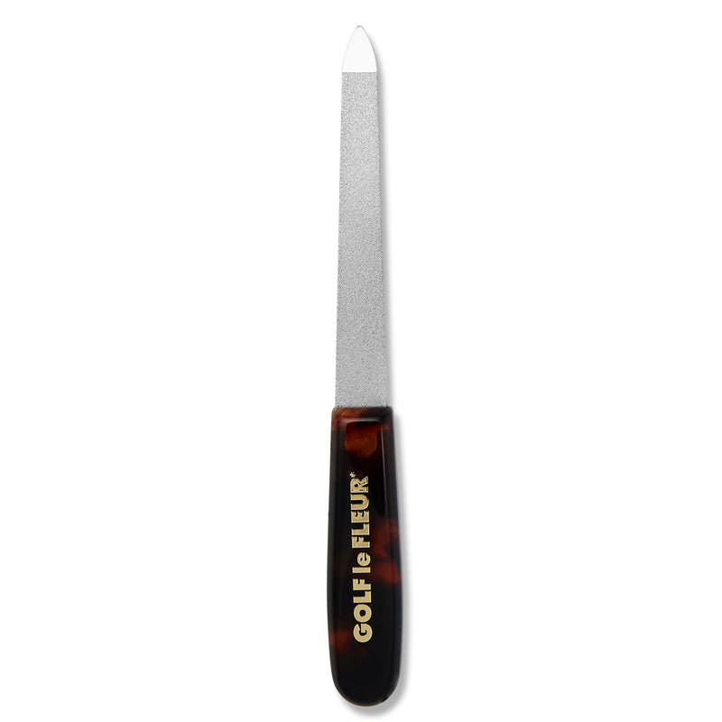 A metal grit blade nail file with tortoise-acetate handle.