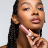 A sheer, hydrating gel gloss that doubles as a barrier restoring lip treatment, delivering color, shine, and lasting moisture in one effortless swipe.