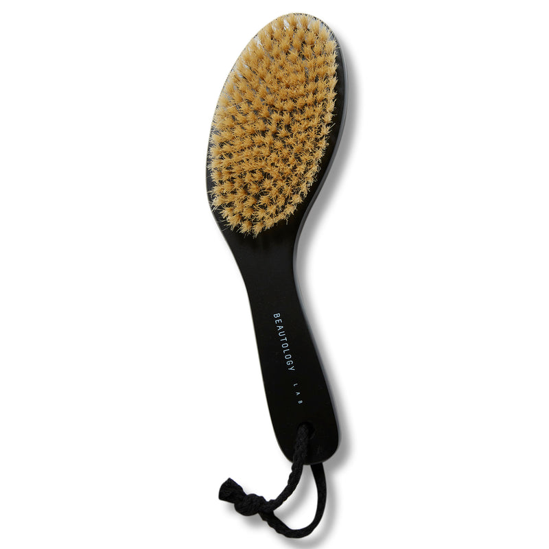 A lymphatic dry brush made of natural grass wood and cruelty-free boar bristles that stimulate lymphatic drainage, increase circulation, and gently exfoliate the skin for a healthy glow.