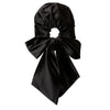 A satin headscarf that can be worn during the day and night that helps to protect hair from breakage, frizz, and tangles.