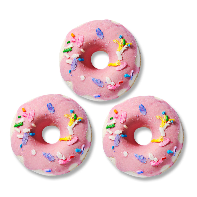 NCLA Beauty A trio of donut-shaped bath bombs in a birthday cake scent to leave skin ultrasoft.