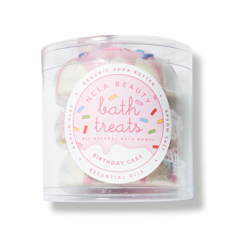 NCLA Beauty A trio of donut-shaped bath bombs in a birthday cake scent to leave skin ultrasoft.